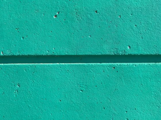 close view of teal colored wall