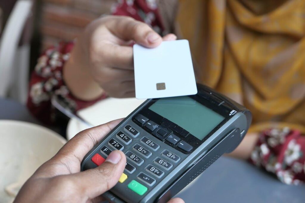 woman paying in a store with her credit card