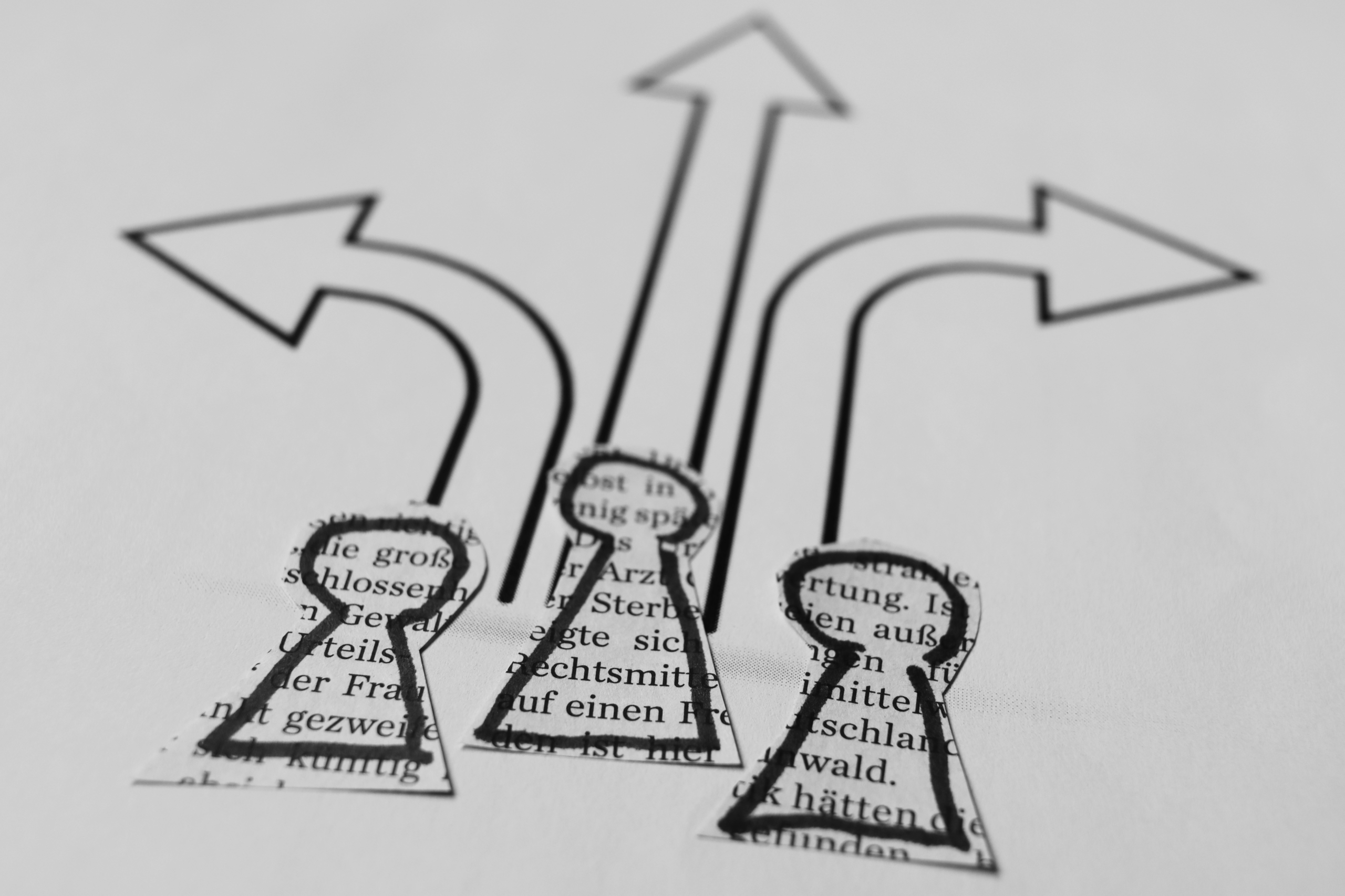 Abstract image of keyhole cutouts with arrows pointing in multiple directions, representing fragmented platform transformation paths